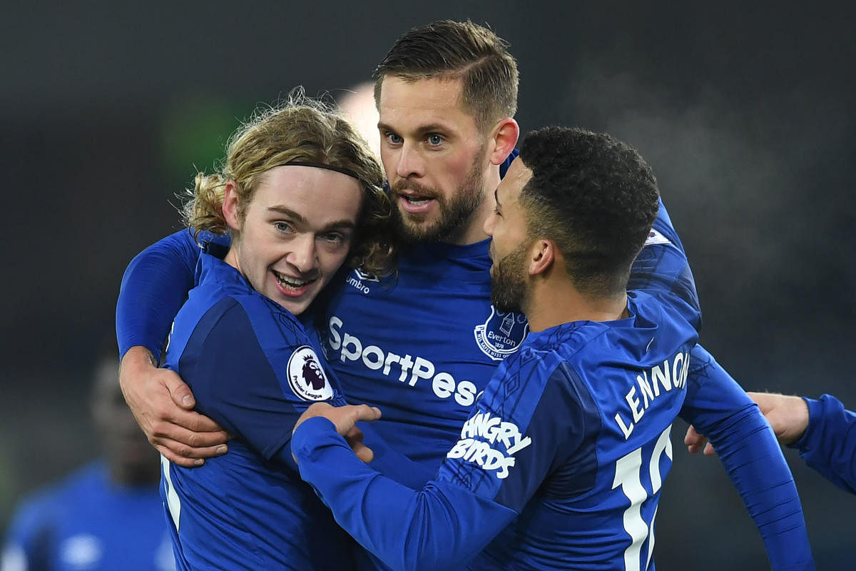 Everton's Gylfi Sigurdsson (centre) celebrates with team-mates after scoring against Swansea City at Goodison Park on Monday. Reuters
