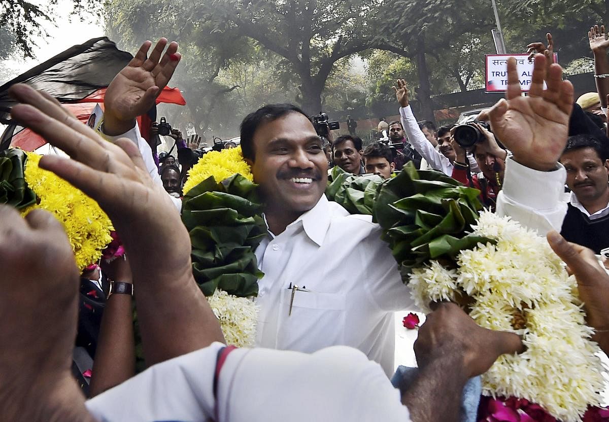 Former Telecom minister A Raja reacts as he celebrates along with his supporters after he was acquitted by a special court in the 2G scam case, in New Delhi on Thursday. PTI Photo