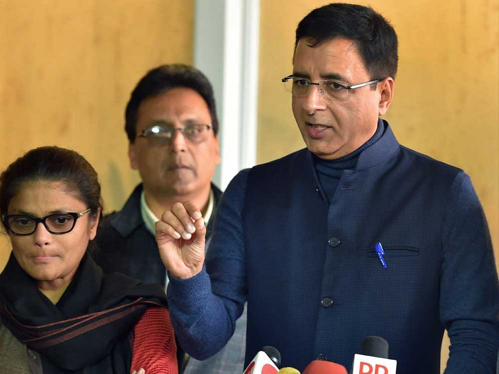 AICC spokesperson Randeep Singh Surjewala with party leader Sushmita Dev addressing the media on 2G scam verdict at Parliament House, in New Delhi on Thursday. PTI Photo