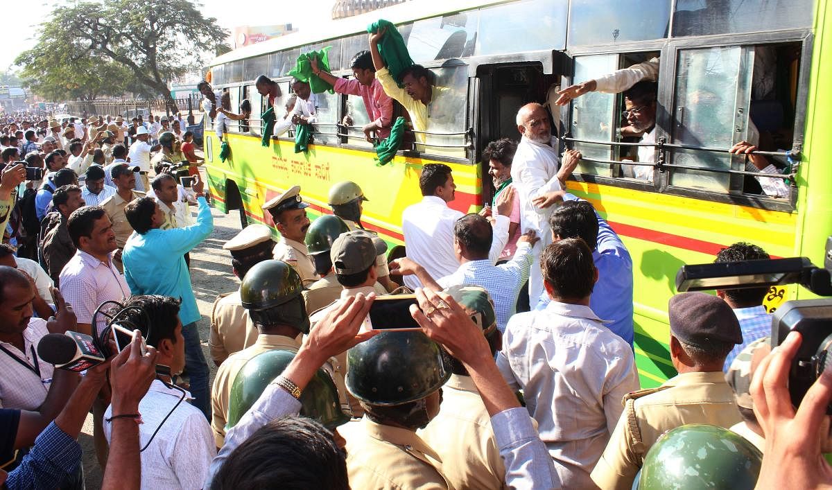 Police shift detained Mahadayi agitators in a bus in Hubballi on Thursday.