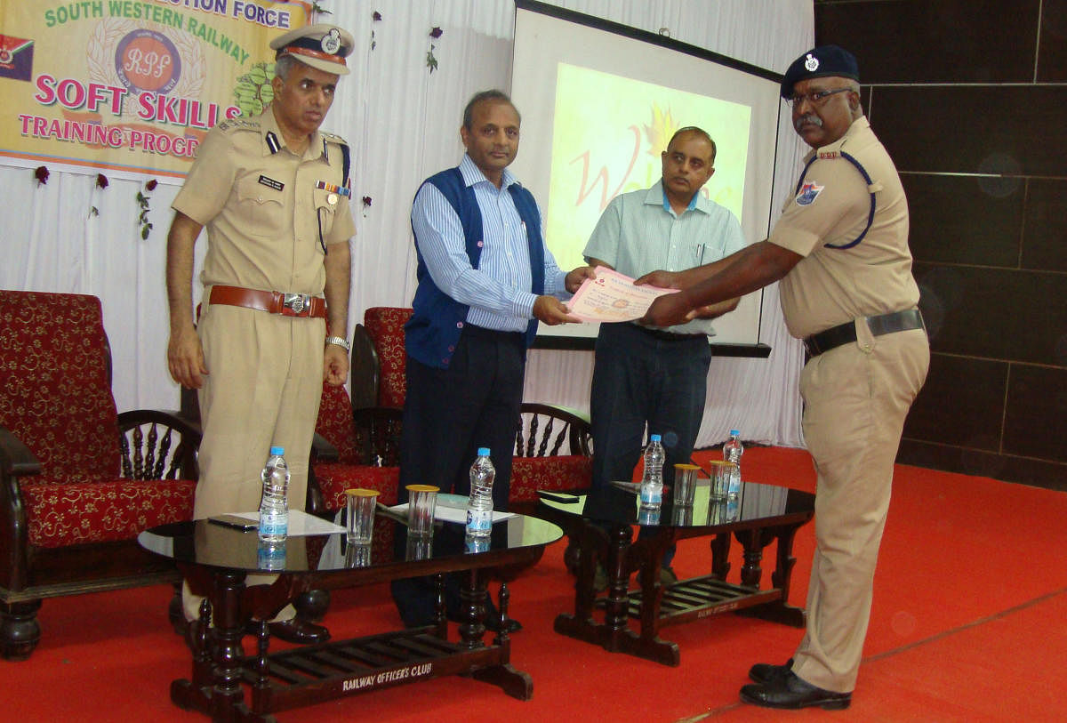SWR GM A K Gupta presents award to a meritorious RPF staff, at the inauguration of soft skills training programme held in Hubballi.