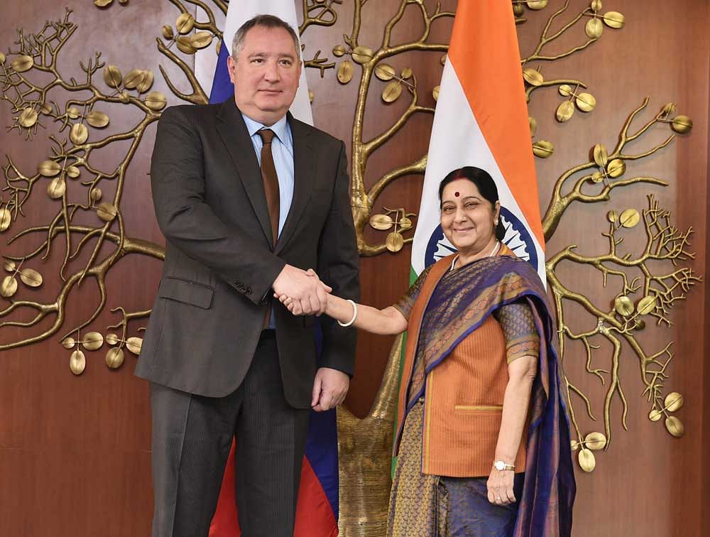 External Affairs Minister Sushma Swaraj shakes hands with Russian Deputy Prime Minister Dmitry Rogozin before a meeting, in New Delhi on Saturday. PTI Photo