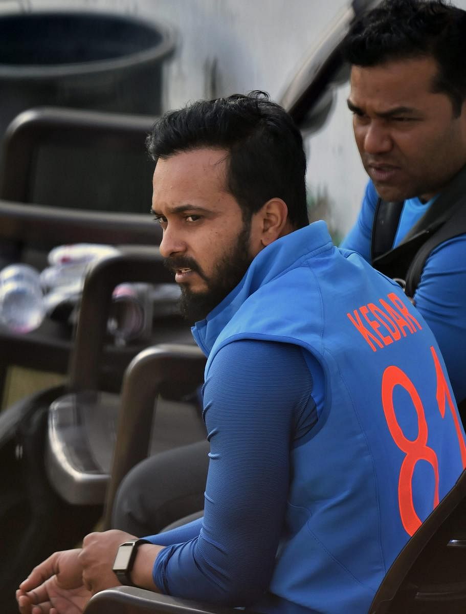 Dharamshala: India's Kedar Jadhav take a rest during a net session on the eve of first ODI match against Sri Lanka at the HPCA Stadium in Dharamshala on Saturday. PTI Photo by Manvender Vashist(PTI12_9_2017_000188B)