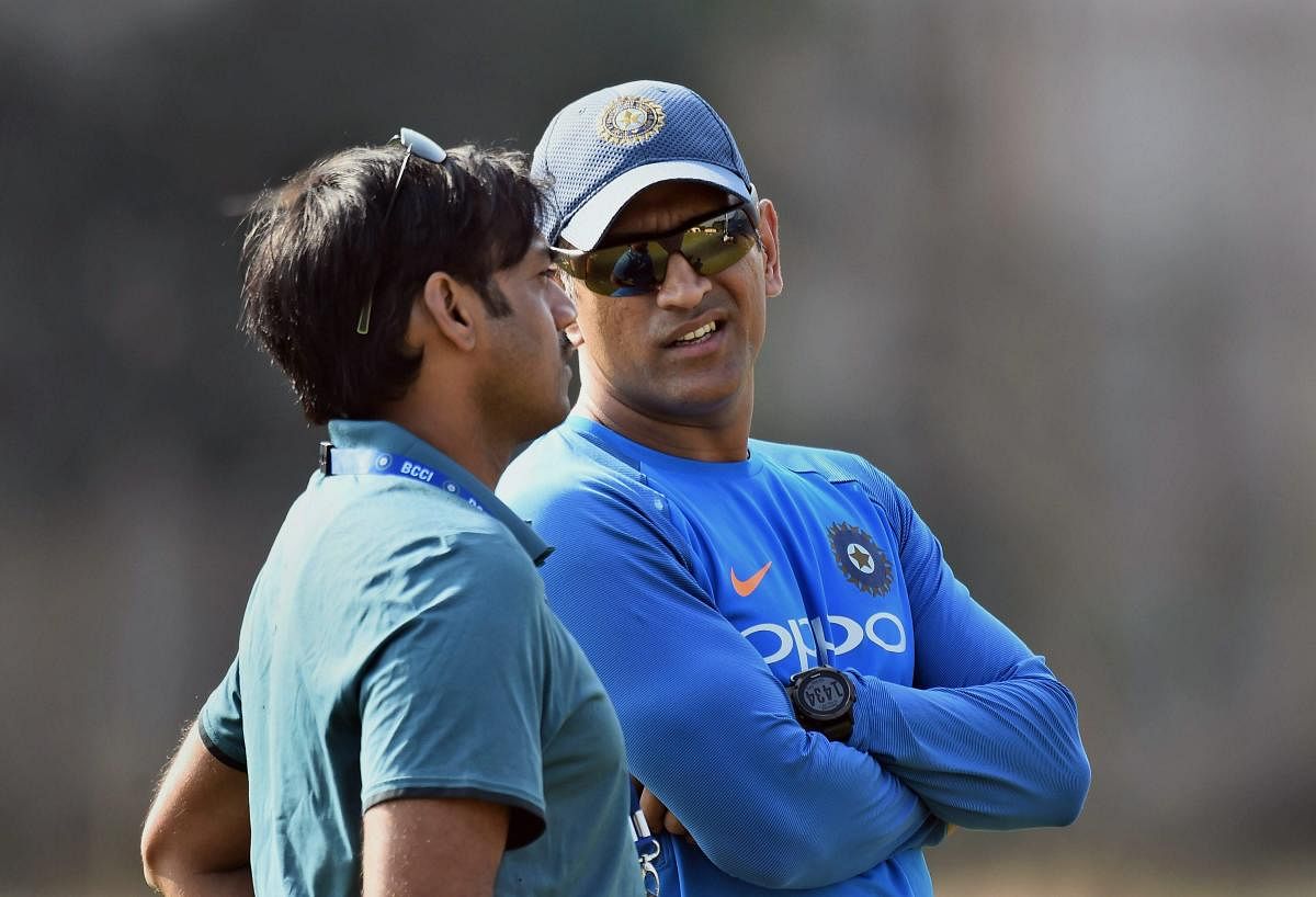 Vizag: Indian cricket team player MS Dhoni and Chief selector of BCCI MSK Prasad during a practice session ahead of the third and final ODI cricket match against Sri Lanka, in Vizag on Saturday. PTI Photo by R Senthil Kumar(PTI12_16_2017_000192A)