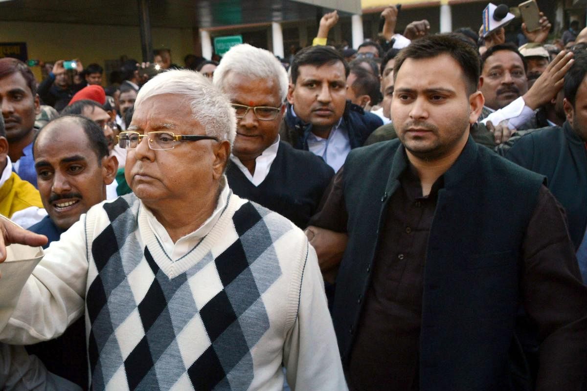 RJD supremo Lalu Prasad Yadav escorted by police officials after being convicted by the special CBI court in a fodder scam case, in Ranchi on Saturday. PTI photo