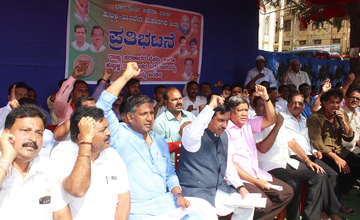 MLA Aravind Bellad, MP Pralhad Joshi, Leader of Opposition in Assembly Jagadish Shettar, and others take part in BJP workers' protest held in front of Mini Vidhan Soudha in Hubballi on Sunday, against the State Government.