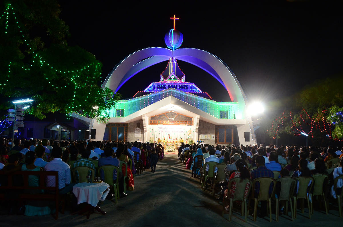 Devotees offering mass to celebrate the birth of Jesus Christ at Infant Jesus shrine at Bikarnakatte in Mangaluru on Sunday night.