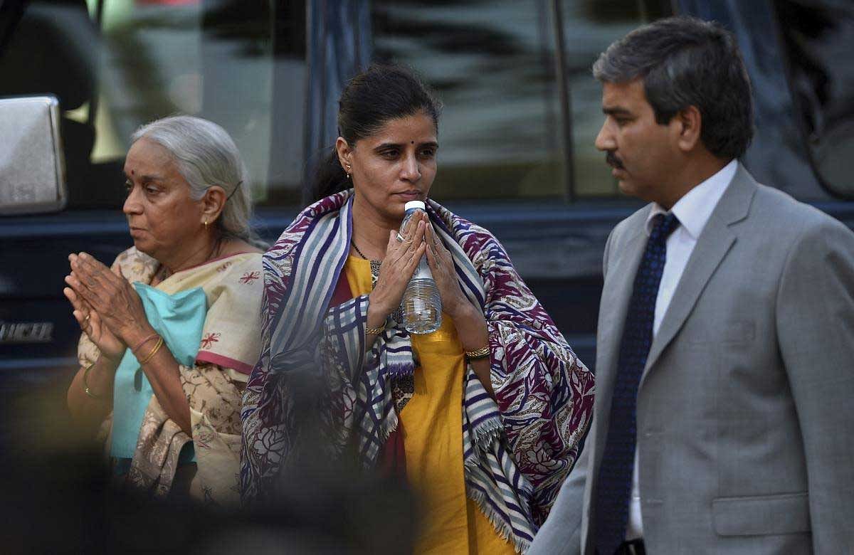 The wife, center, and mother, left, of imprisoned Indian naval officer Kulbhushan Jadhav, gesture to media upon arrival with an Indian diplomat, left, for meeting with Jadhav at Foreign Ministry in Islamabad, Pakistan, Monday, Dec. 25, 2017. The wife and mother of an imprisoned Indian naval officer facing the death penalty in Pakistan for espionage and sabotage were allowed to meet with him on Monday in what the Foreign Ministry said was a humanitarian gesture. AP/PTI(