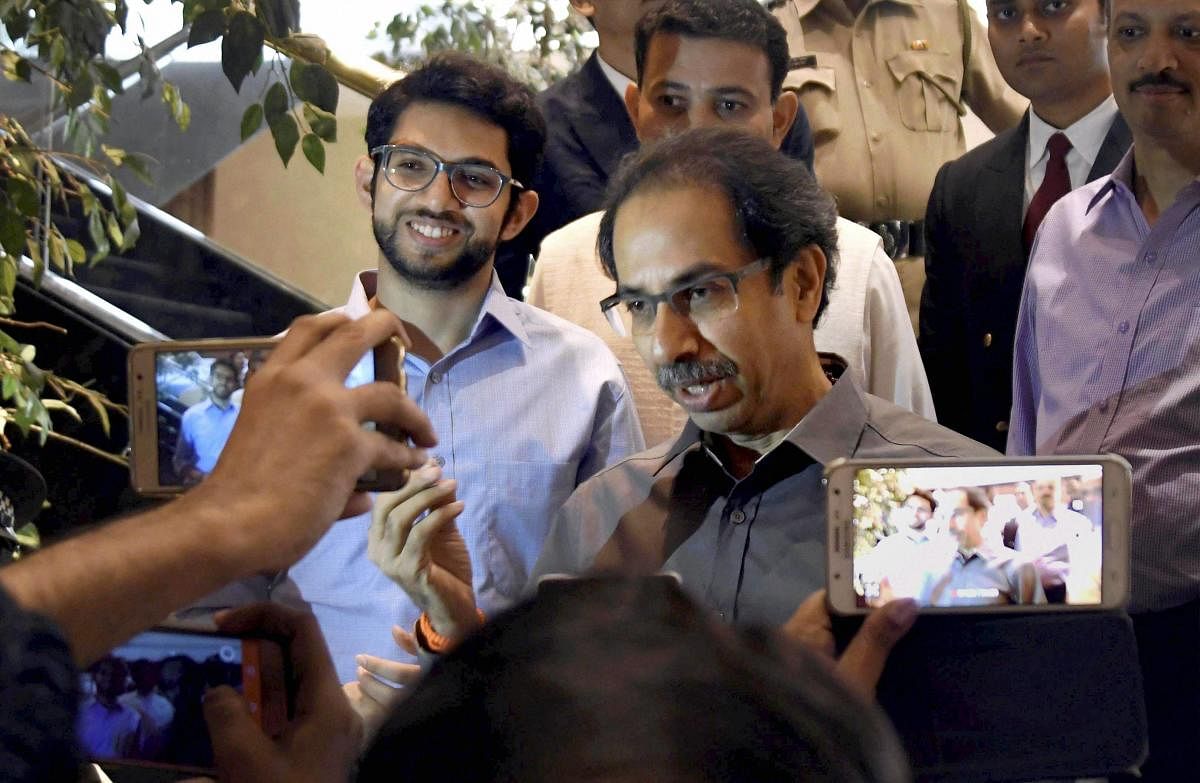 Shiv Sena chief Uddhav Thackeray (right) with Aditya Thackeray. PTI file photo