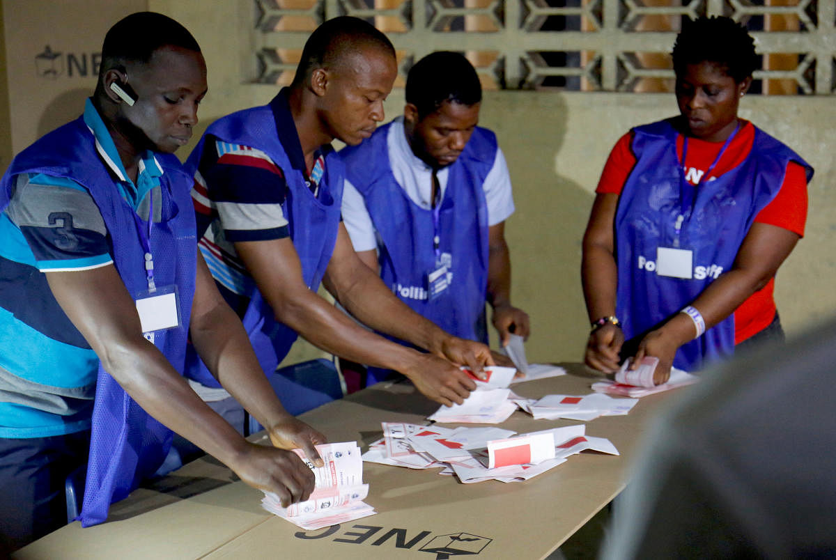 Polling staff start to count the ballots for the Liberian presidential election at a polling station in Monrovia, Liberia. REUTERS