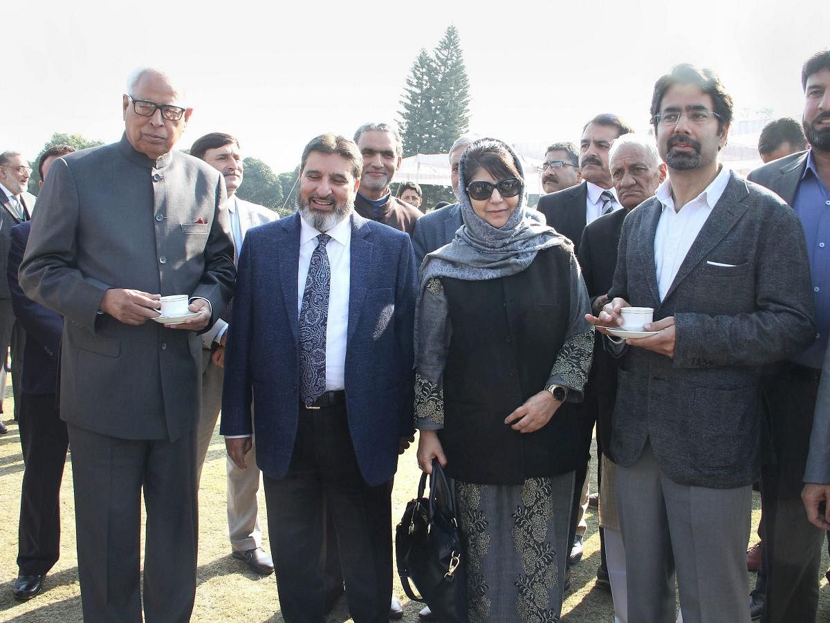 Jammu and Kashmir Governor N N Vohra (extreme left) along with Chief Minister Mehbooba Mufti (centre) and her brother Tassaduq Hussain Mufti (extreme right) after the swearing-in ceremony of the newly inducted ministers, at Raj Bhavan in Jammu on Thursday. PTI