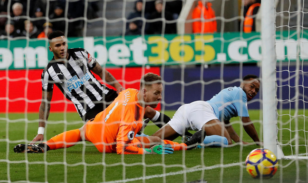 Manchester City's Raheem Sterling (right) watches his shot go past Newcastle United goalkeeper Rob Elliot (centre) during their Premier League tie on Wednesday. Reuters