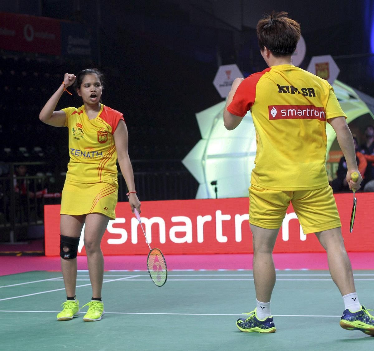 In-form: N Sikki Reddy (left) and Kim Rang of Bengaluru Blasters react after winning a point against Ashwini Ponappa and Vladimir Ivanov of Delhi Dashers during the Premier Badminton League mixed doubles match in New Delhi on Thursday. PTI