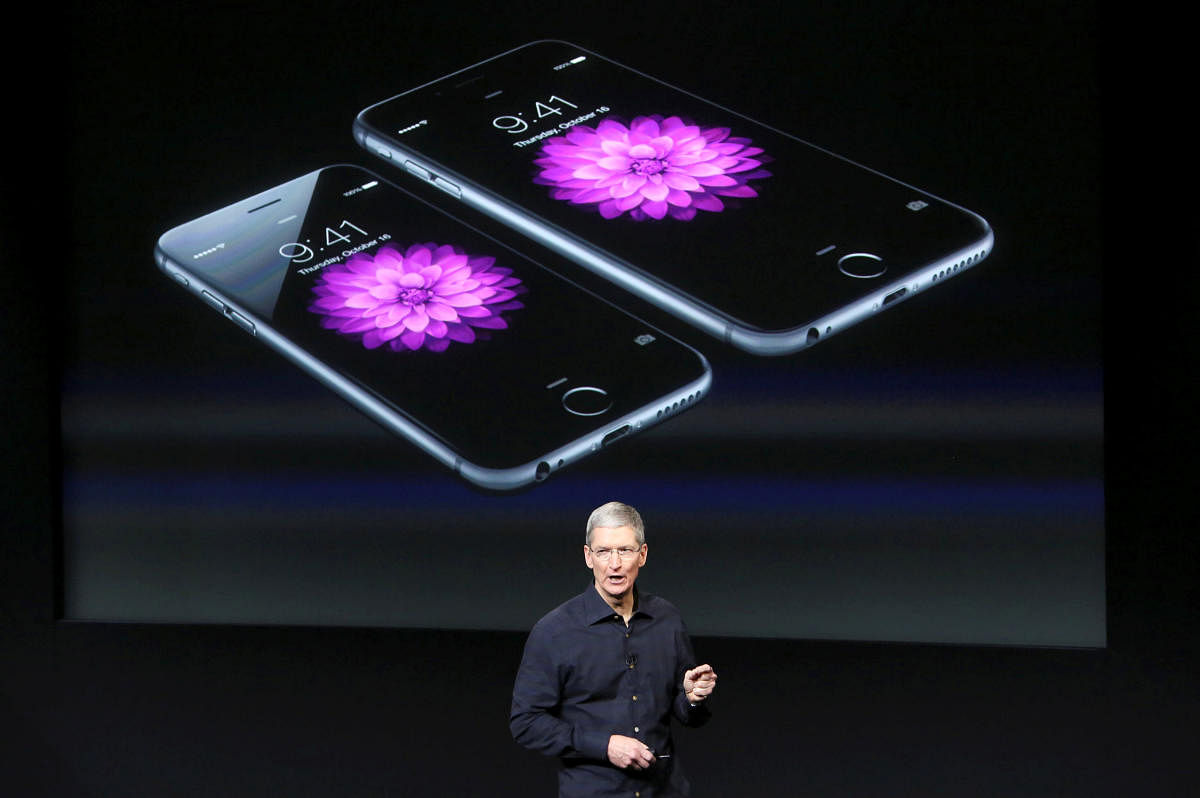 Apple CEO Tim Cook stands in front of a screen displaying the iPhone 6. Reuters file photo