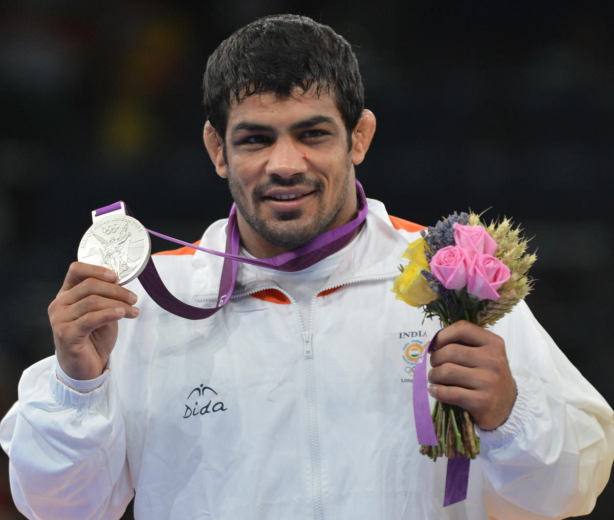 Wrestler Sushil Kumar, who won a silver medal in London Olympics in 2012, has been booked by the Delhi police on Saturday in connection with his supporters clashing with the fans of his rival Praveen Rana, after a bout in Delhi on Friday. DH FILE