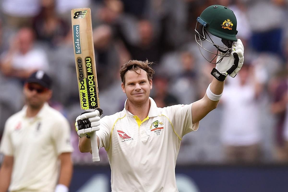 Australian skipper Steve Smith celebrates after reaching his century against England on the final day of the fourth Ashes match at the MCG in Melbourne. AFP