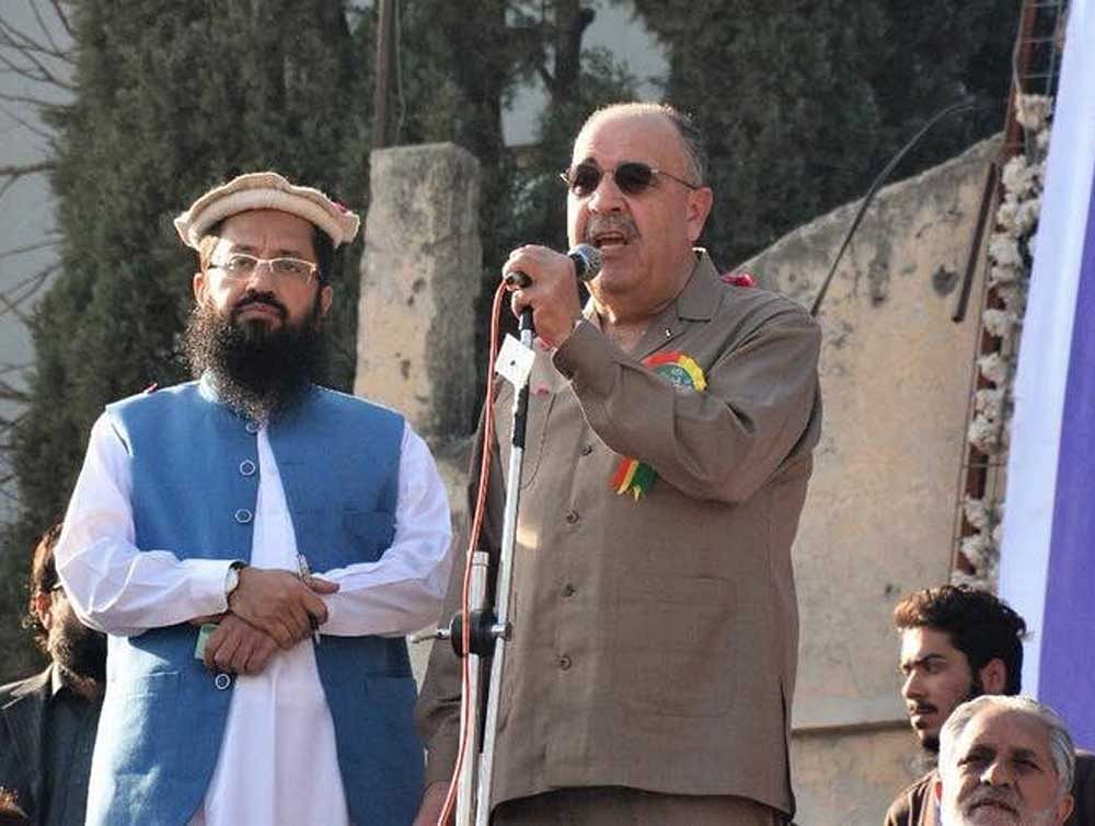 Walid Abu Ali speaking at an event organised by JuD head Hafiz Saeed. Twitter photo.