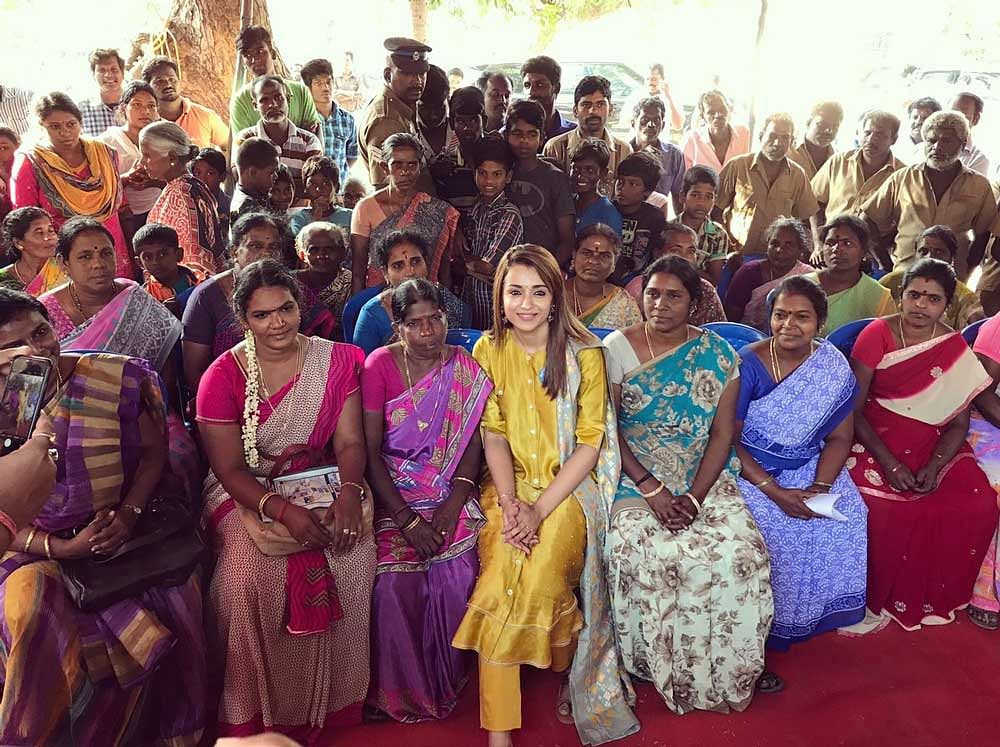 Trisha poses for a photo with several women. The actress says that toilets are critcal of the safety and dignity of women.