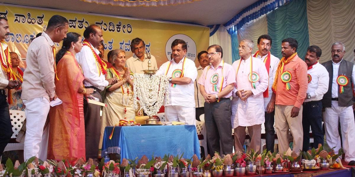 MLA K G Bopaiah inaugurates Kannada Sahithya Sammelana programme at Karike in Madikeri taluk on Saturday.