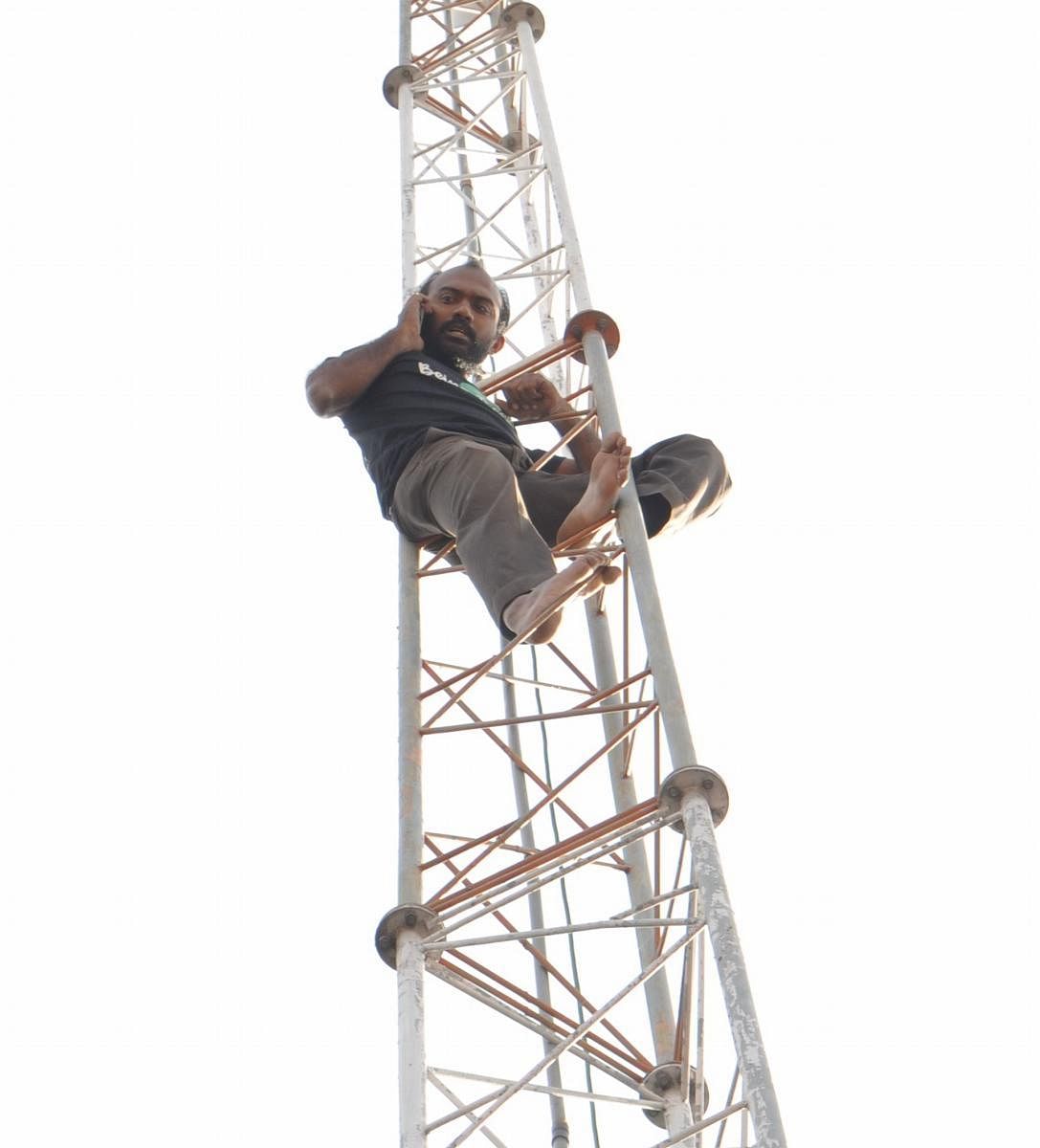 Krishna on the CCTV camera tower in Sanjay Circle in Mandya on Saturday.