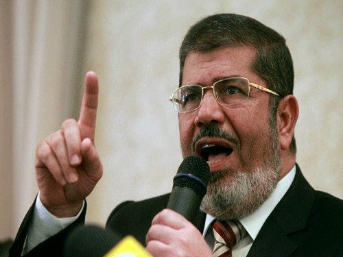 An Egyptian court sentenced ousted Islamist president Mohamed Morsi to three years in prison along with 19 other defendants on Saturday for insulting the judiciary, his lawyer said. AP file photo
