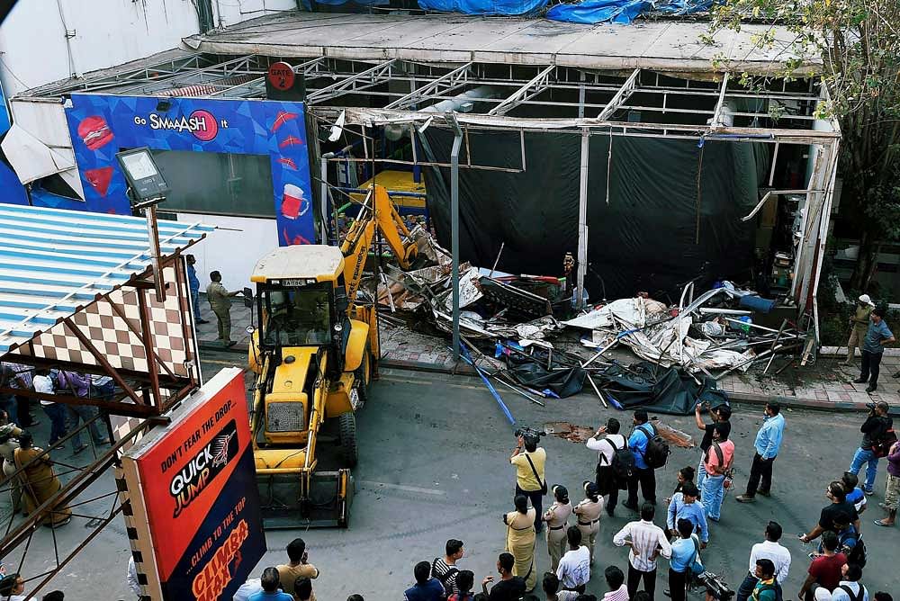 BMC razes the unauthorised structures of wellknown Sports and Entertainment Hub Smash as part of its crackdown on illegal structures after a fire in a pub claimed 14 lives. PTI photo.