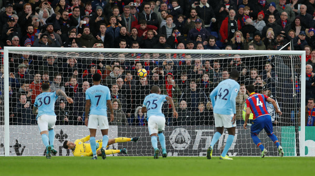 TIMELY... Manchester City goalkeeper saves a penalty by Crystal Palace's Luka Milivojevic in London on Sunday. Reuters