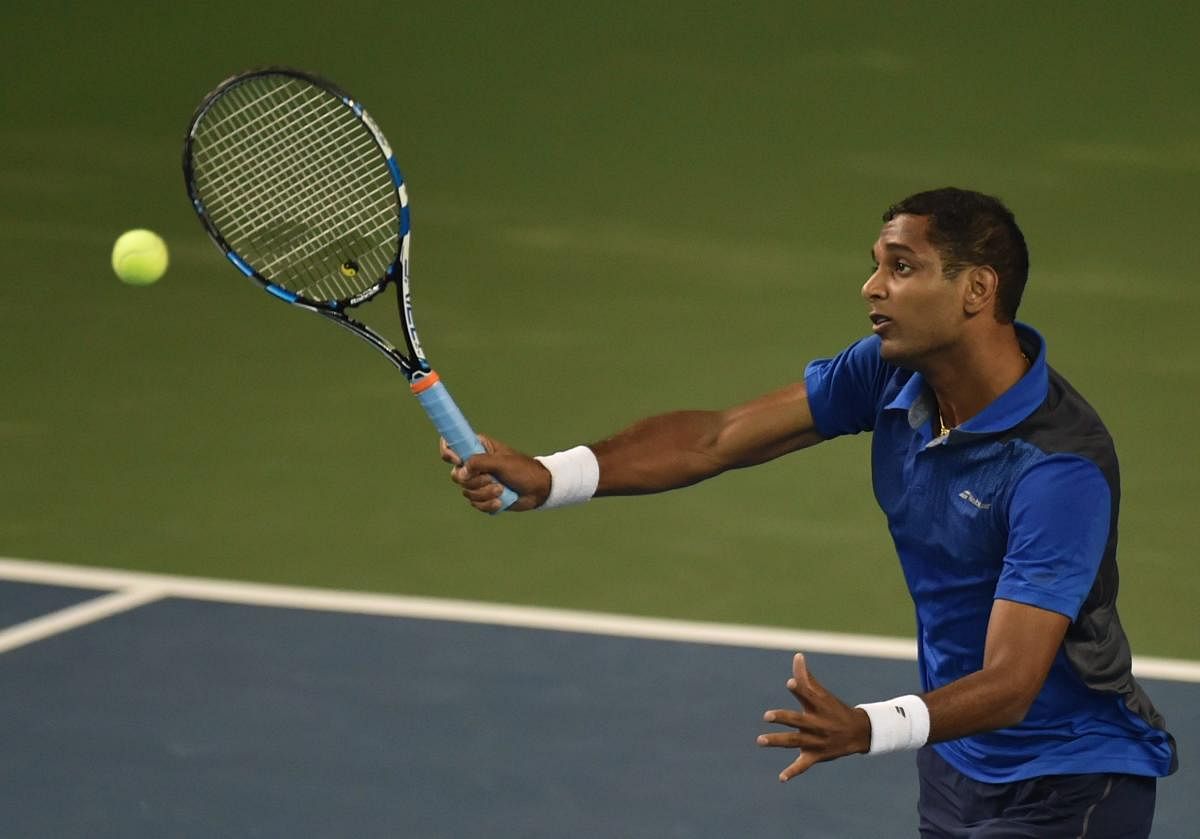 FOCUSED India's Ramkumar Ramanathan in action during his win over ... in the Tata Open Maharashtra in Pune on Monday. PTI
