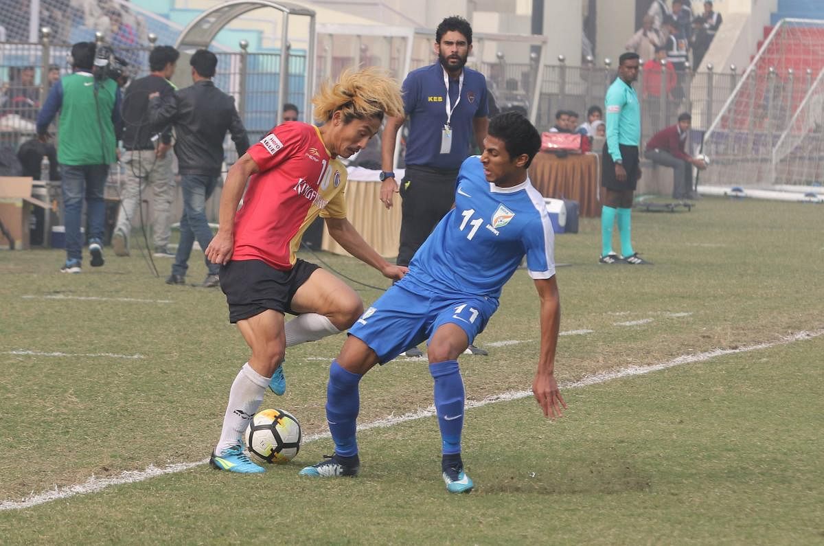 East Bengal's Katsumi Yusa (left) goes past Aniket Jadav of Indian Arrows during their I-League tie at the Ambedkar stadium in New Delhi on Tuesday. I-League Media