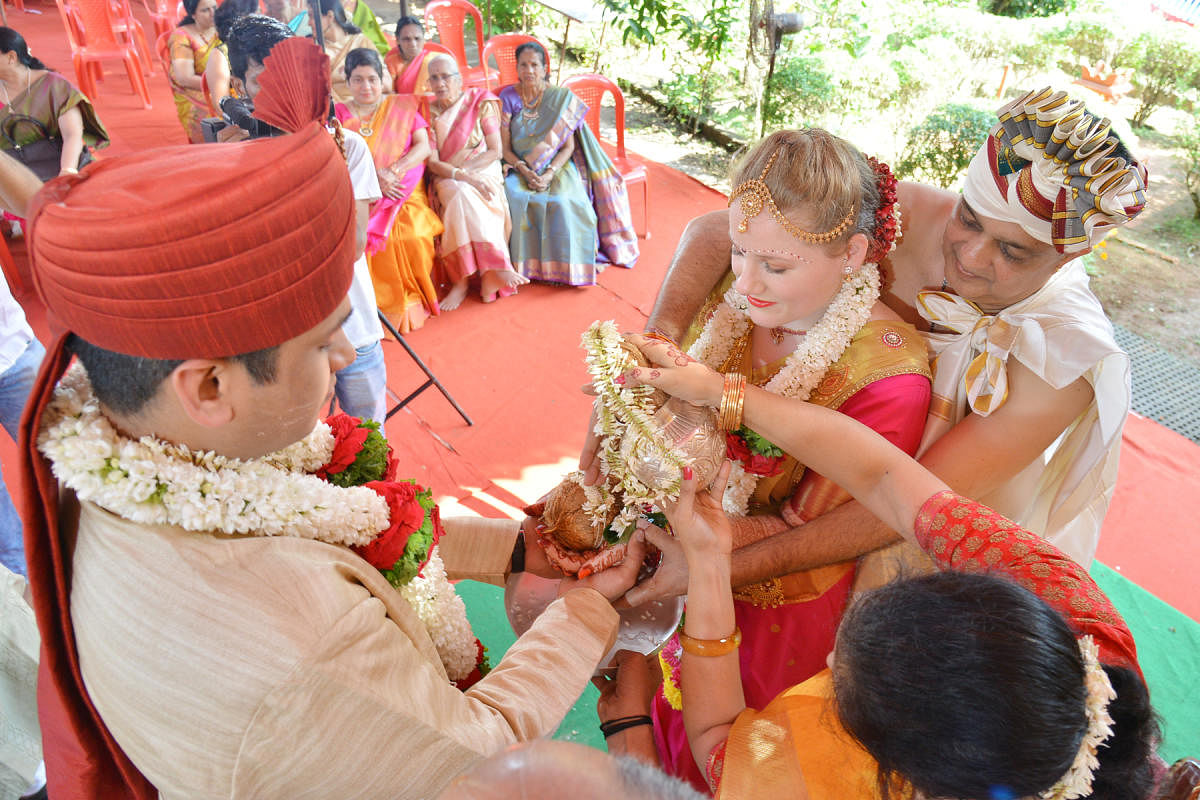 2ptr4, 5 6A bride from America enters into a wedlock in a traditional style in Puttur.