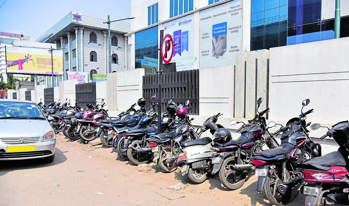 Bikes parked at a non-parking area on Tumkur Road.