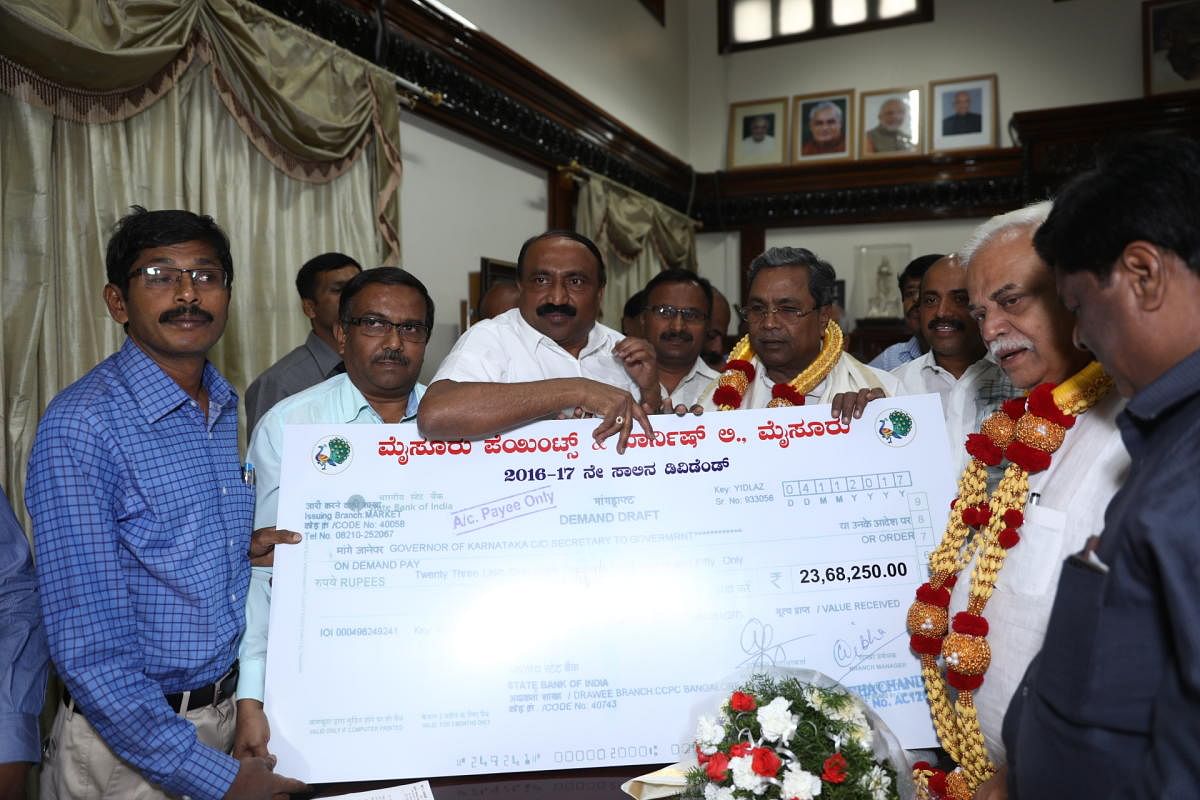 Mysore Paints and Varnish Limited Chairman H A Venkatesh presented a cheque for Rs 23.68 lakh, towards payment of dividend to the state government, to the Chief Minister Siddaramaiah in Bengaluru, recently.