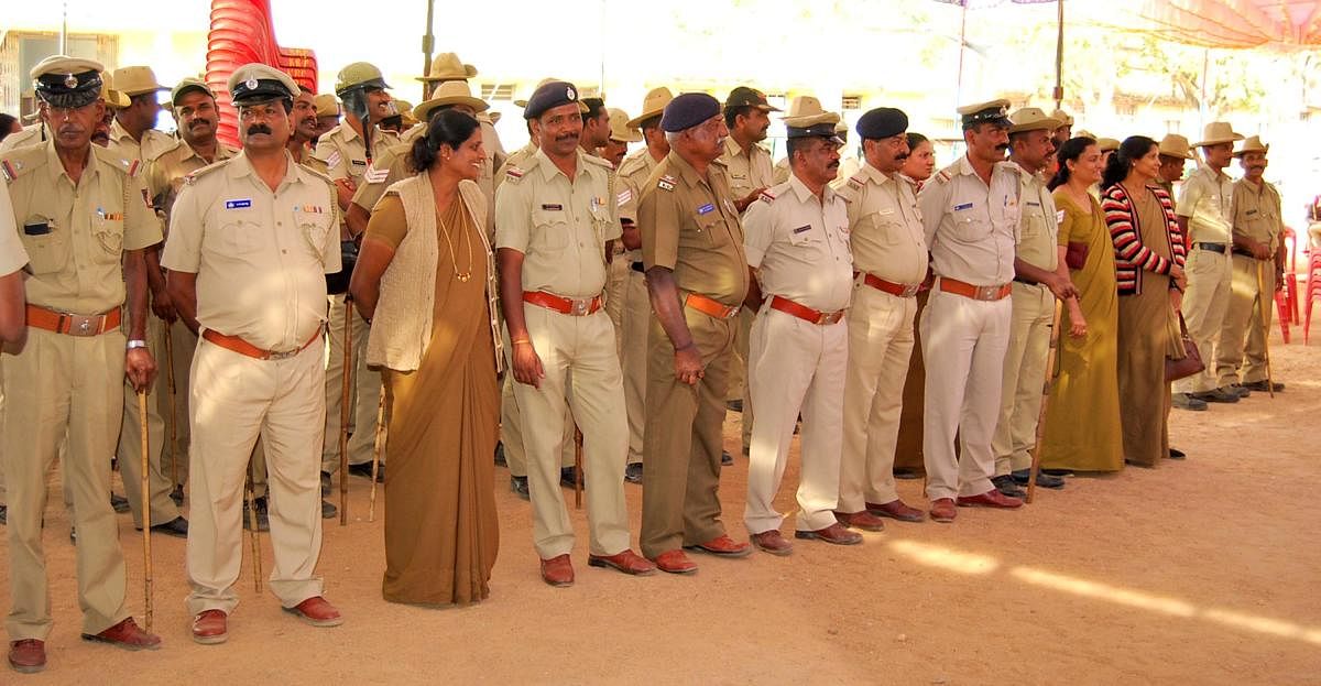 Police personnel deputed for the chief minister's programme in Belur, Hassan district.