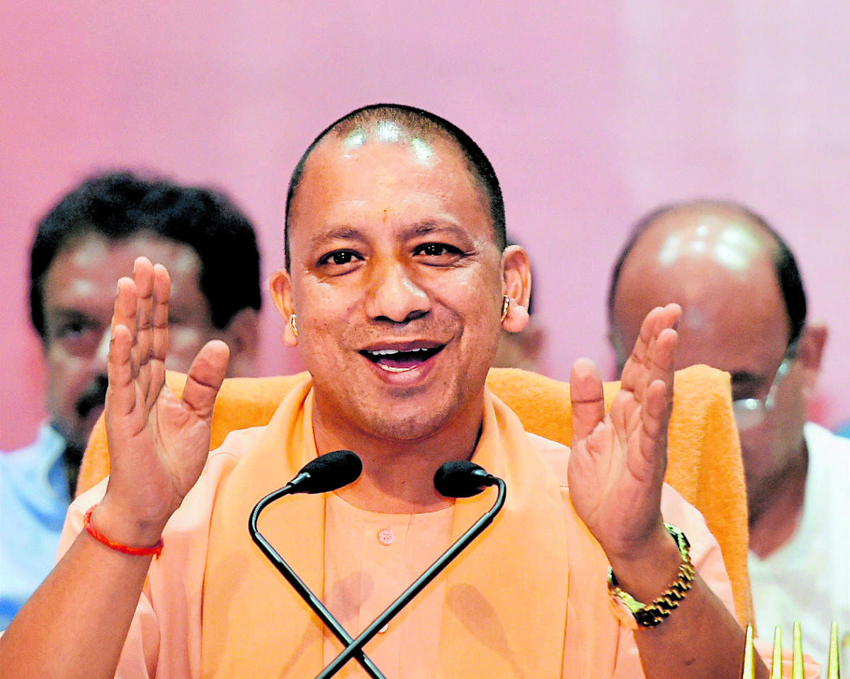 Lucknow: Uttar Pradesh Chief Minister Yogi Adityanath addresses a press conference after releasing 'white paper' on completing six months in office, at Lok Bhawan in Lucknow on Monday. PTI Photo by Nand Kumar(PTI9_18_2017_000113B)