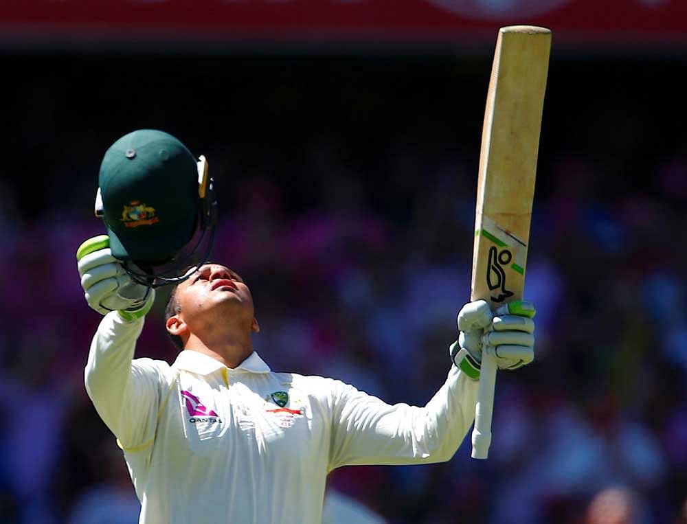Australia's Usman Khawaja celebrates after reaching his century during the third day of the fifth Ashes cricket test match. REUTERS