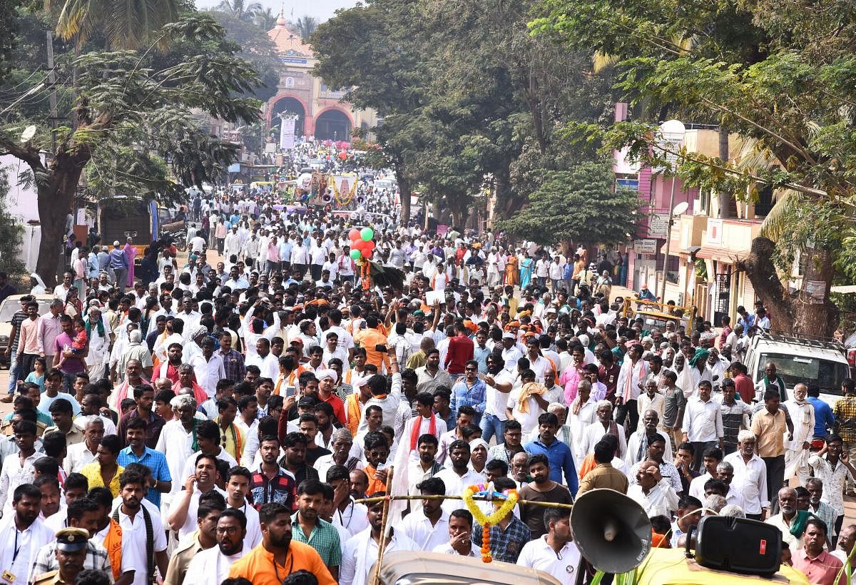 Hundreds of people take part in the rally taken out from Siddharoodamutt in Hubballi on Thursday.