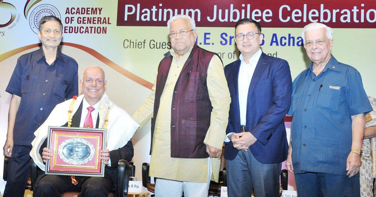 Nagaland Governor P B Acharya felicitating MAHE Pro Chancellor Dr H S Ballal during the platinum jubilee celebrations of Academy of General Education in Mangaluru on Thursday.
