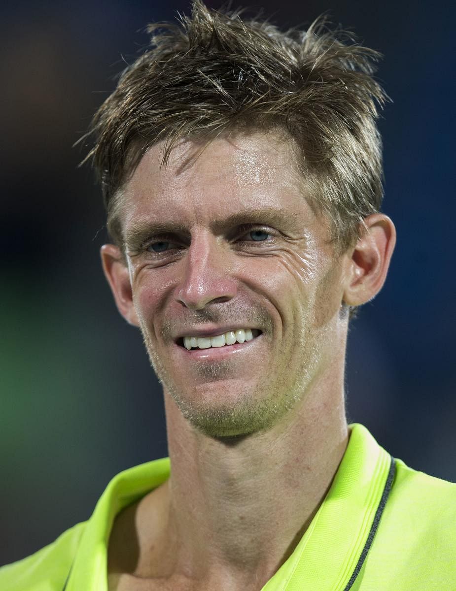 South Africa's Kevin Anderson smiles after winning the Mubadala World Tennis Championship 2017 match in Abu Dhabi, on December 30, 2017. / AFP PHOTO / NEZAR BALOUT