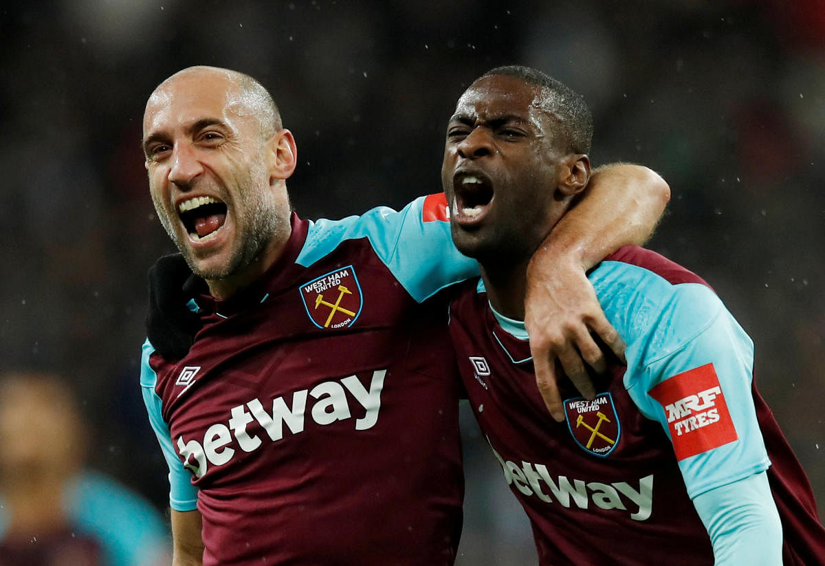 SCORCHER West Ham United's Pedro Obiang (right) celebrates with team-mate Pablo Zabaleta after scoring against Tottenham Hotspur on Thursday night. REUTERS