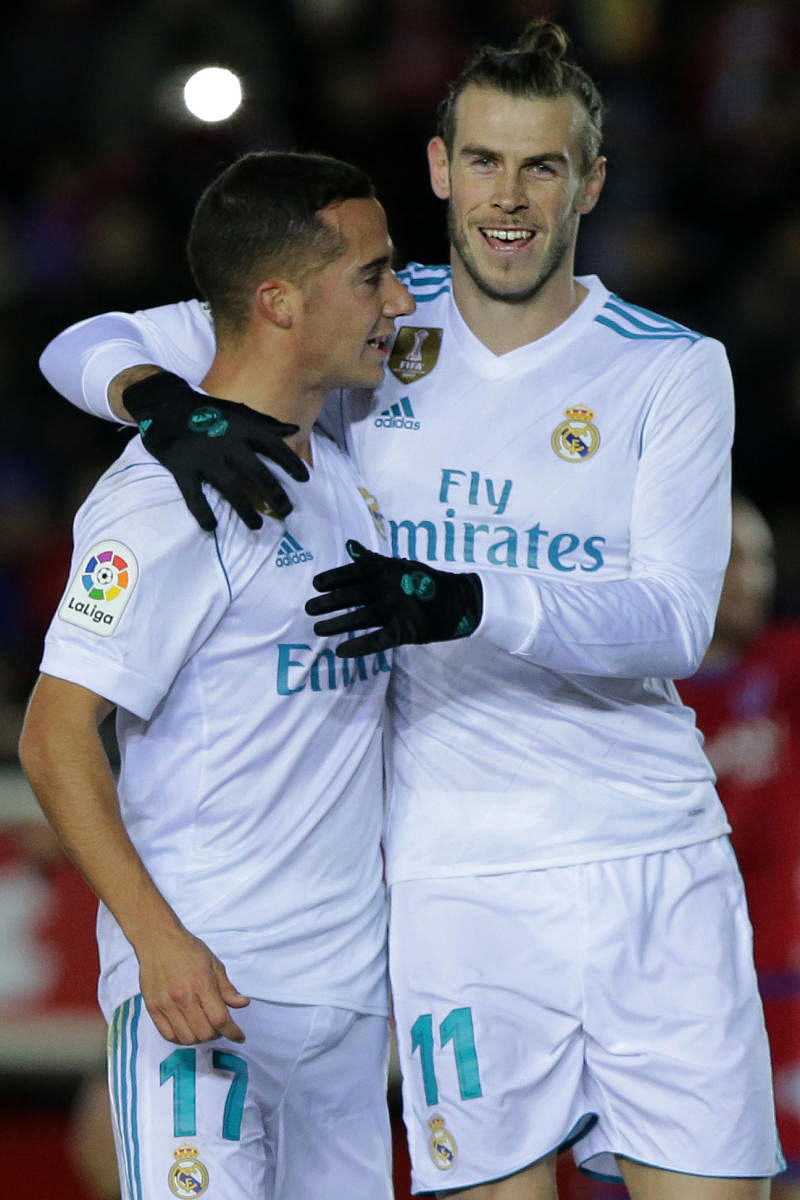 ON TARGET Real Madrid's Gareth Bale (right) celebrates with Lucas Vazquez after scoring against Numancia during their Kings Cup clash on Thursday. AFP