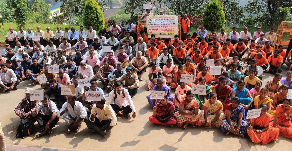 Villagers of Kanthabailu Dabbadka conduct a protest in front of the DC's office in Madikeri on Friday, urging for road repair. DHPhoto