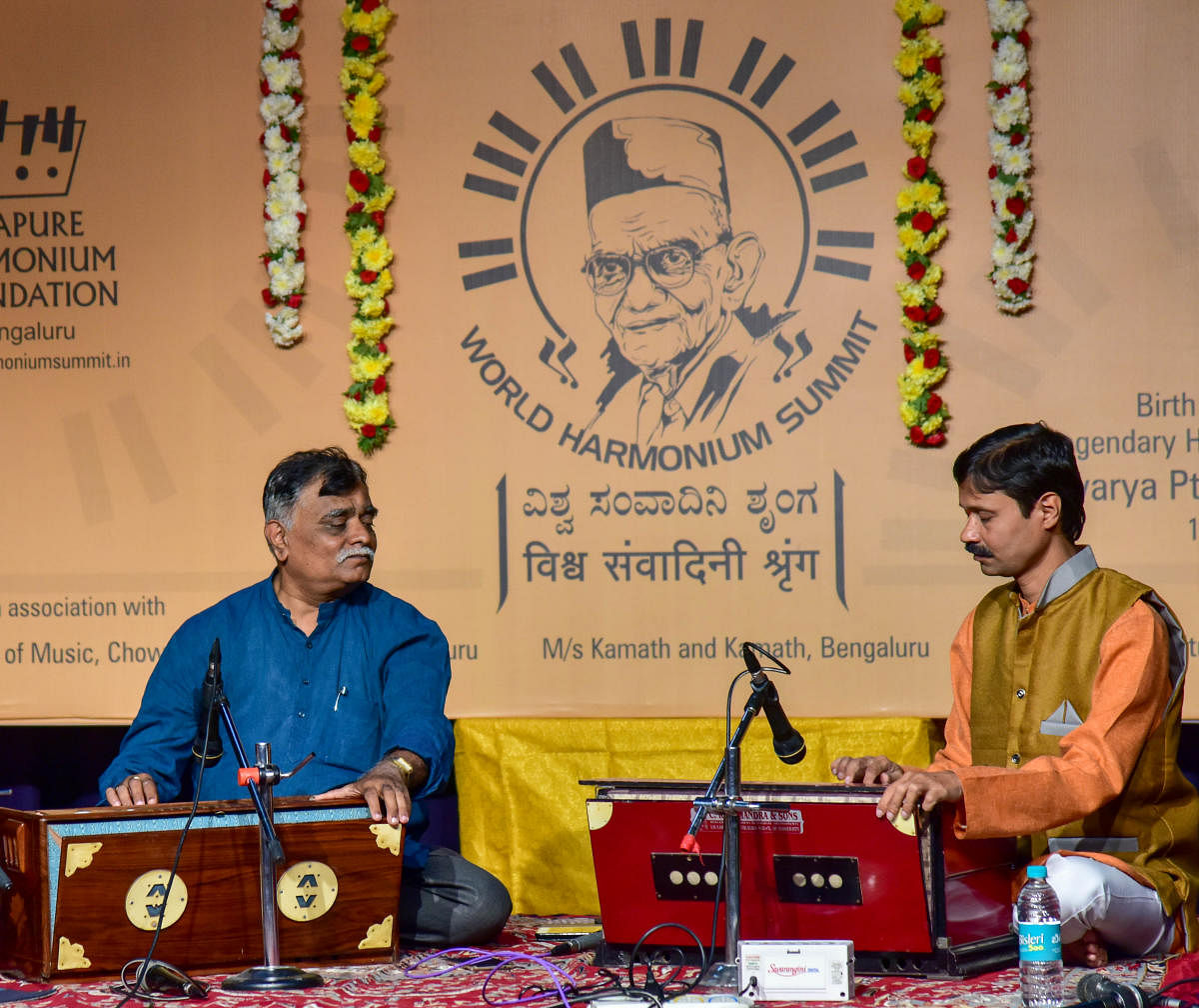 Harmonium Duet by Umakanth Puranik and Narasimha Kulkarni, at the inauguration section of 'WORLD HARMONIUM SUMMIT', organised by Bijapure Harmonium Foundation at Krishnadevaraya Kalyana Mantapa, in Bengaluru on Friday. Photo/ B H Shivakumar