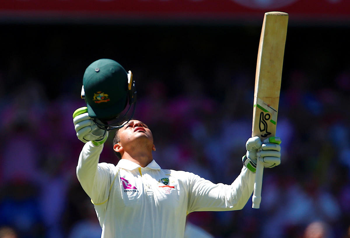 MOMENT TO SAVOUR Australia's Usman Khawaja celebrates after reaching his century during the third day of the fifth Ashes Test against England on Saturday. REUTERS
