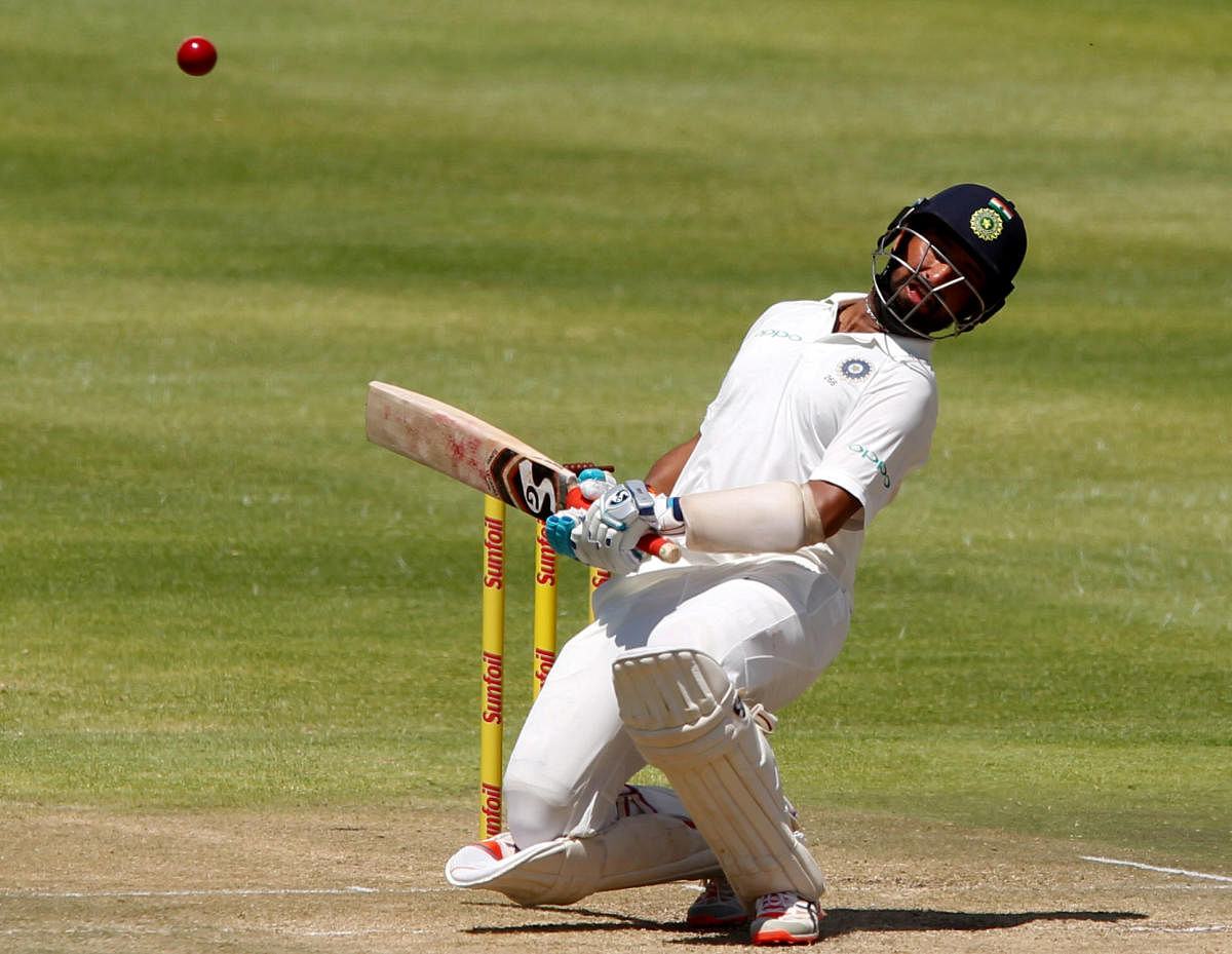 India's Cheteshwar Pujara leaves a ball as the South African pacers peppered him with a probing spell. REUTERS