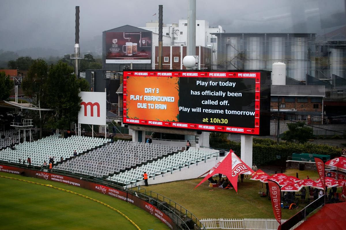 The scoreboard announces the calling off of the day's play in Cape Town on Sunday.