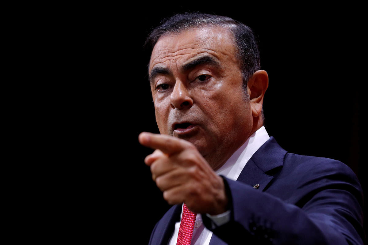 FILE PHOTO: Carlos Ghosn, Chairman and CEO of the Renault-Nissan Alliance, gestures as he speaks during a news conference in Paris, France, September 15, 2017. REUTERS/Philippe Wojazer/File Photo