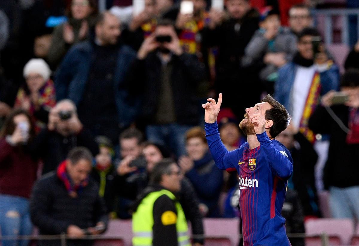 LEGEND Barcelona's Lionel Messi celebrates his goal against Levante during their La Liga match at the Camp Nou stadium on Sunday. AFP