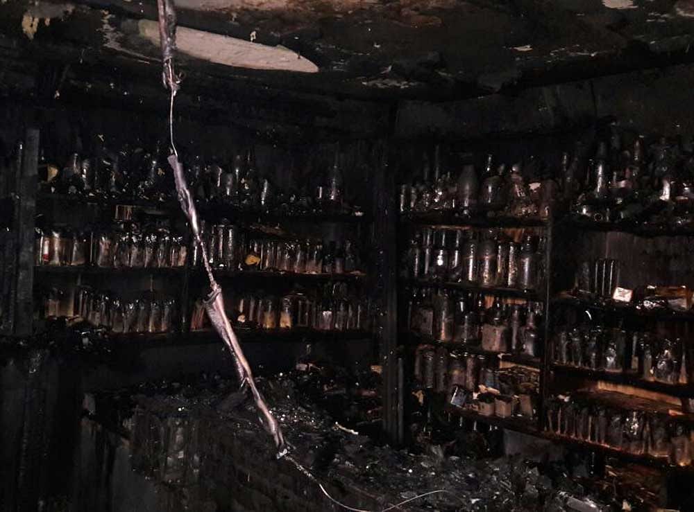 The fire broke out at the Kailash bar and restaurant located in the ground floor of Kumbaara sangha building.  DH Photo