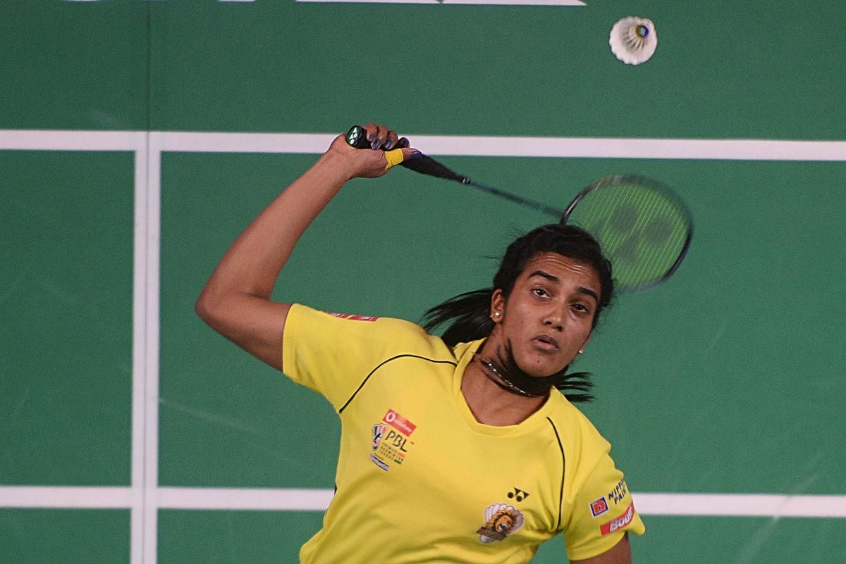 ON TARGET Chennai Smashers' P V Sindhu returns to Kristy Gilmour of Bengaluru Blasters in their  Premier Badminton League game in Chennai on Monday. AFP