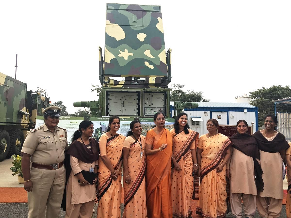 Nirmala Sitharaman, pose for a photo with the women employees of BEL involved in Akash Missile project and other radar projects during her visit to BEL on Tuesday